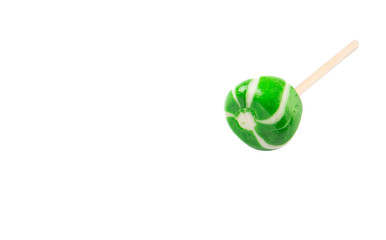 Green swirl peppermint candies over white background