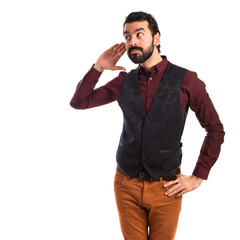 Fototapeta premium Man wearing waistcoat listening something
