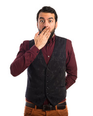 Man wearing waistcoat doing surprise gesture