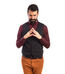 Man wearing waistcoat thinking