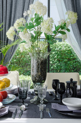 flower in glass vase on dinnig table