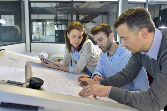 Team of architects working on construction project