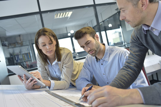 Team of architects working on construction project