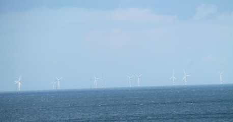 A Collection of Wind Turbines at a Coastal Site.