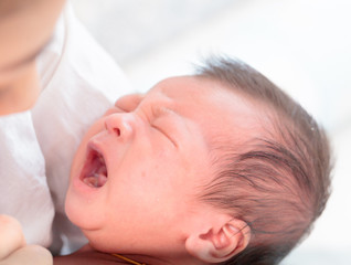 Obraz na płótnie Canvas Newborn asian baby cry