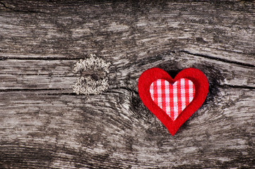 Red heart on the wooden background