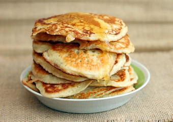 Delicious pancakes with honey, close-up