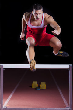 athlete on hurdle in track and field