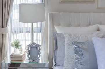 white lamp with picture frame on glass table