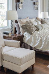 luxury bedroom with white lamp on wooden table