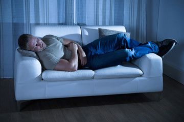Obraz premium Man Sleeping On Couch