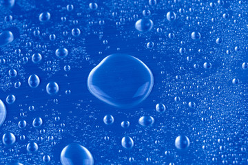 Drops of water on blue background