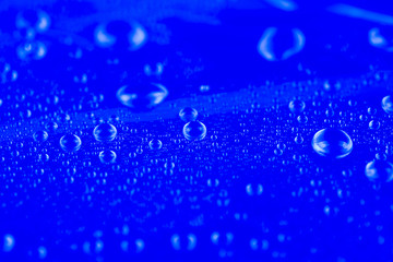 Drops of water on blue background