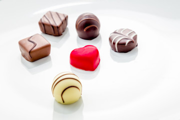 Heart shaped chocolate with other confectionery around