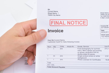 Man Holding Invoice With Final Notice Stamp