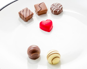 Heart shaped chocolate with other confectionery around