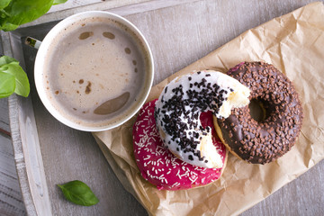 coffee and donut on wood background