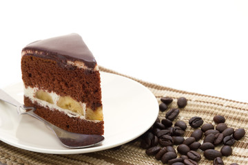 Chocolate banana cake isolated on white background