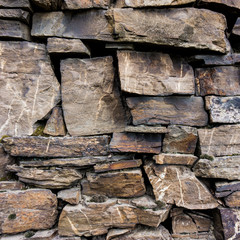old stone wall. pattern of decorative slate stone wall surface.