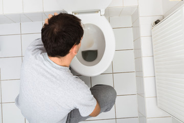 Man Vomiting In Bathroom