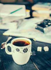 A cup of hot tea on a wooden table