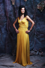 brunette woman wearing yellow evening dress