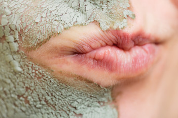 Skin care. Woman in clay mud mask on face. Beauty.