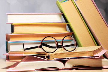 Composition with glasses and books,