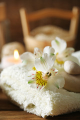 Composition of spa treatment, candles in bowl with water