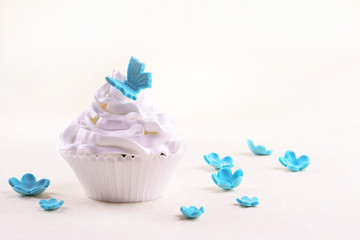 Delicious cupcake on beige background