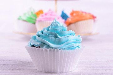 Delicious cupcakes on table close-up