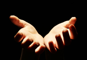 Obraz premium Female hands on dark background
