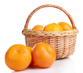 Tangerines in basket isolated on white