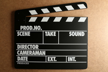 Movie clapper on wooden background