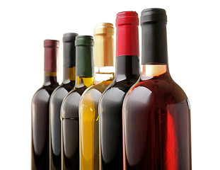 Wine bottles in row isolated on white