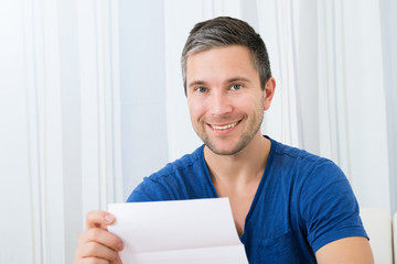 Happy Man Holding Letter