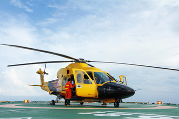The helicopter landing on at oil platform © chanjaok1
