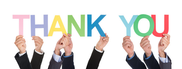 Many Hands Holding The Word Thank You