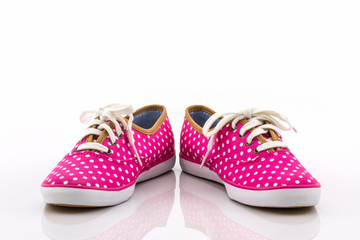 Pink polka dot canvas shoe.