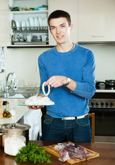 man cooking in home kitchen © JackF