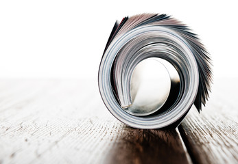 magazine roll on wooden desk
