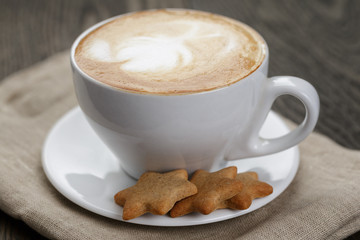 cup of cappuccino with home cookies