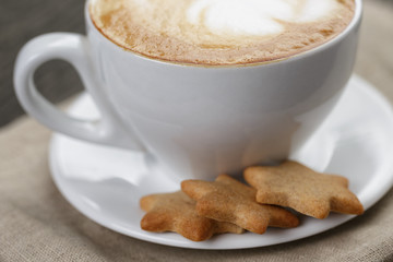 cup of cappuccino with home cookies