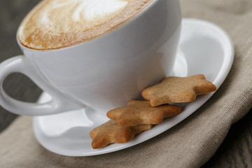cup of cappuccino with home cookies