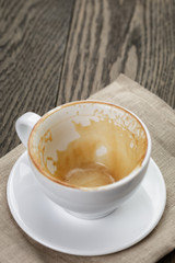 empty coffee cup on oak wood table
