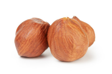 three hazelnut kernels isolated