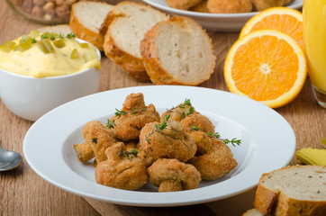 Breaded fried mushrooms with juice