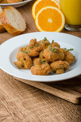 Breaded fried mushrooms with juice