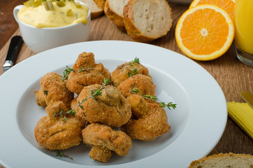 Breaded fried mushrooms with juice