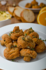 Breaded fried mushrooms with juice